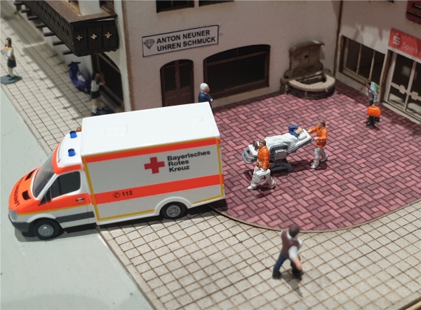 Paramedic with mobile stretcher N